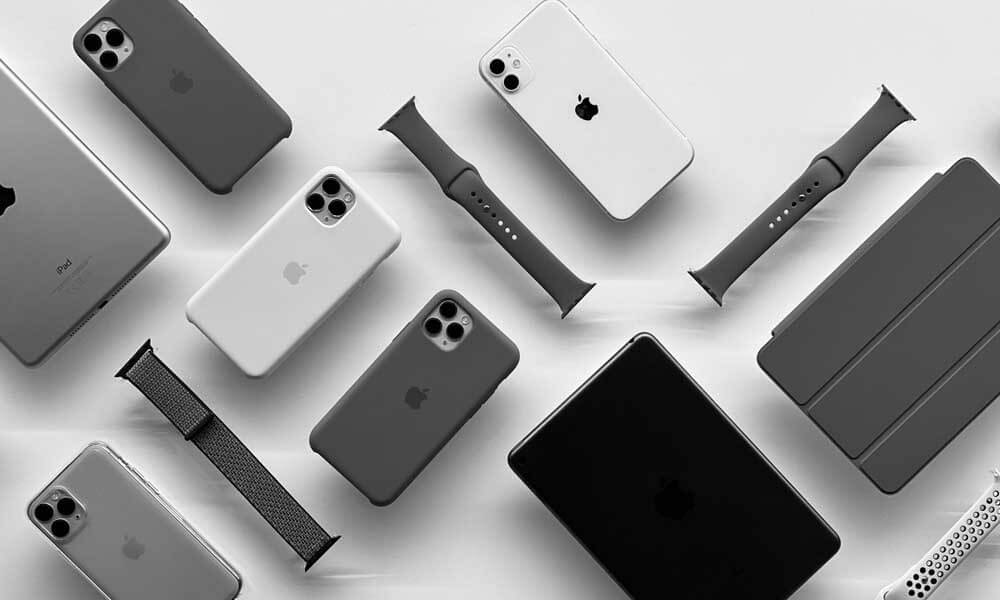 Various Apple products - iPhone, Apple Watch, iPad - in gray colors