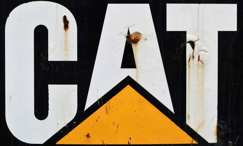 CAT - Caterpillar - logo on rusted signboard