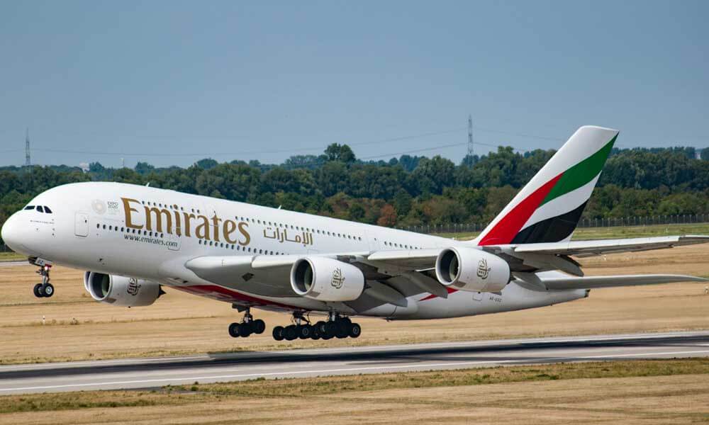Emirates aeroplane taking off on runway