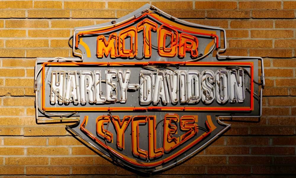 Neon Harley-Davidson sign on brick wall