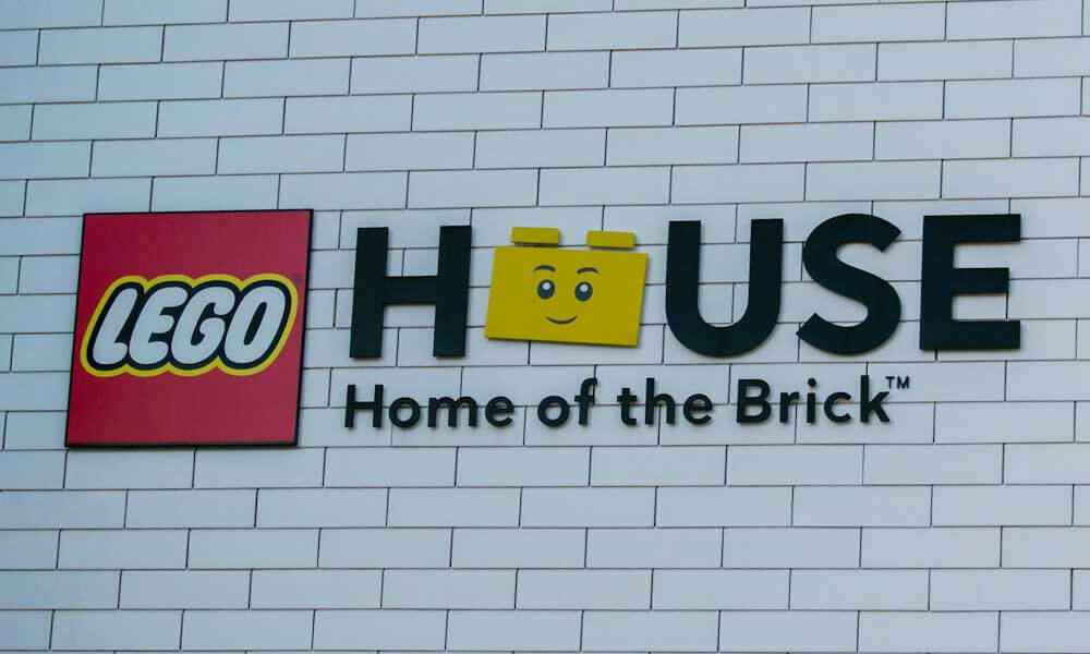 Lego House sign on a white wall