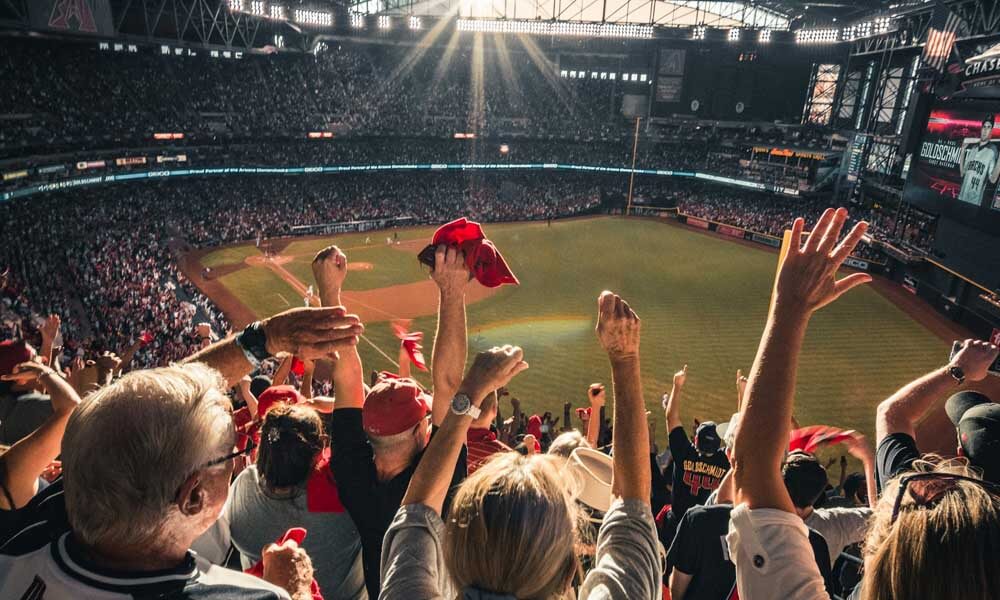 People cheering at football stadium