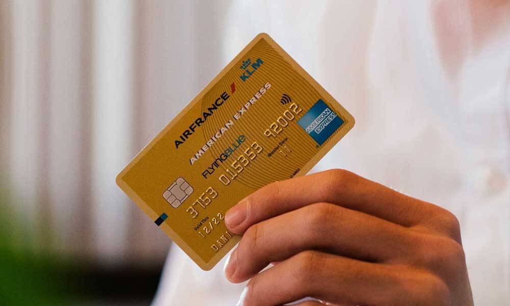 Person holding American Express credit card