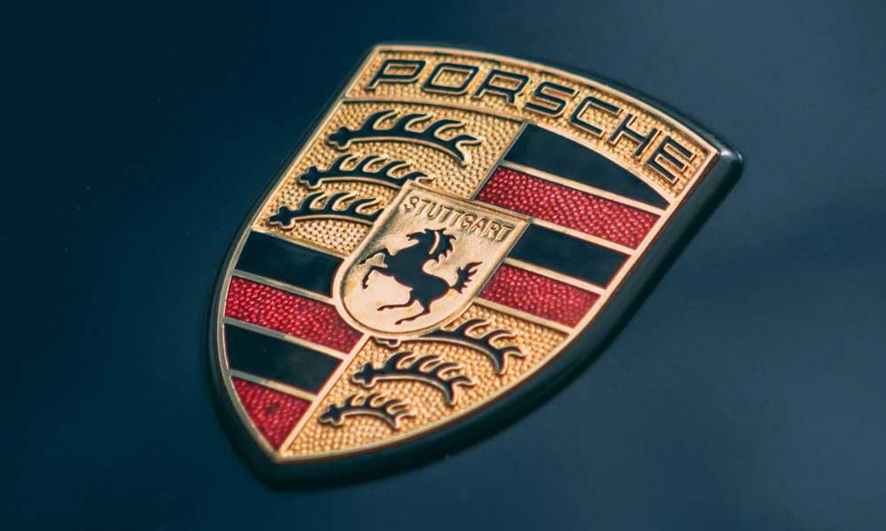 Porsche logo on dark background
