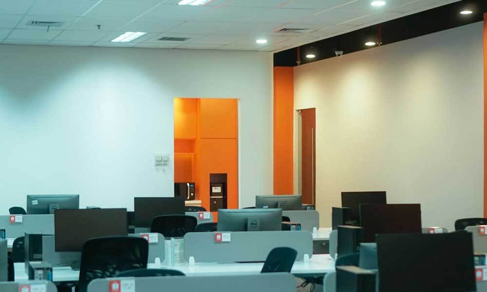 Interior of a Shopee office with walls painted Shopee orange color